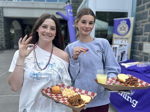 students holding food